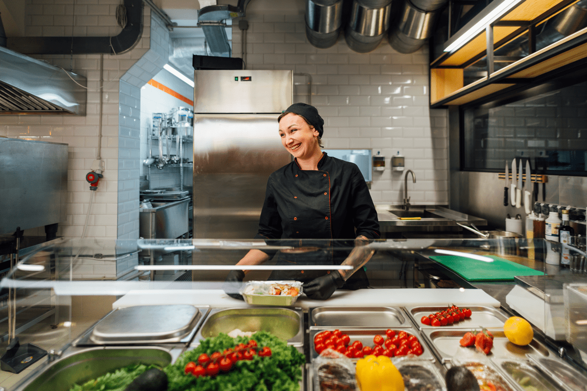 joyful-cafe-worker-prepares-salad-catering-kitche-2022-01-18-23-45-18-utc-min