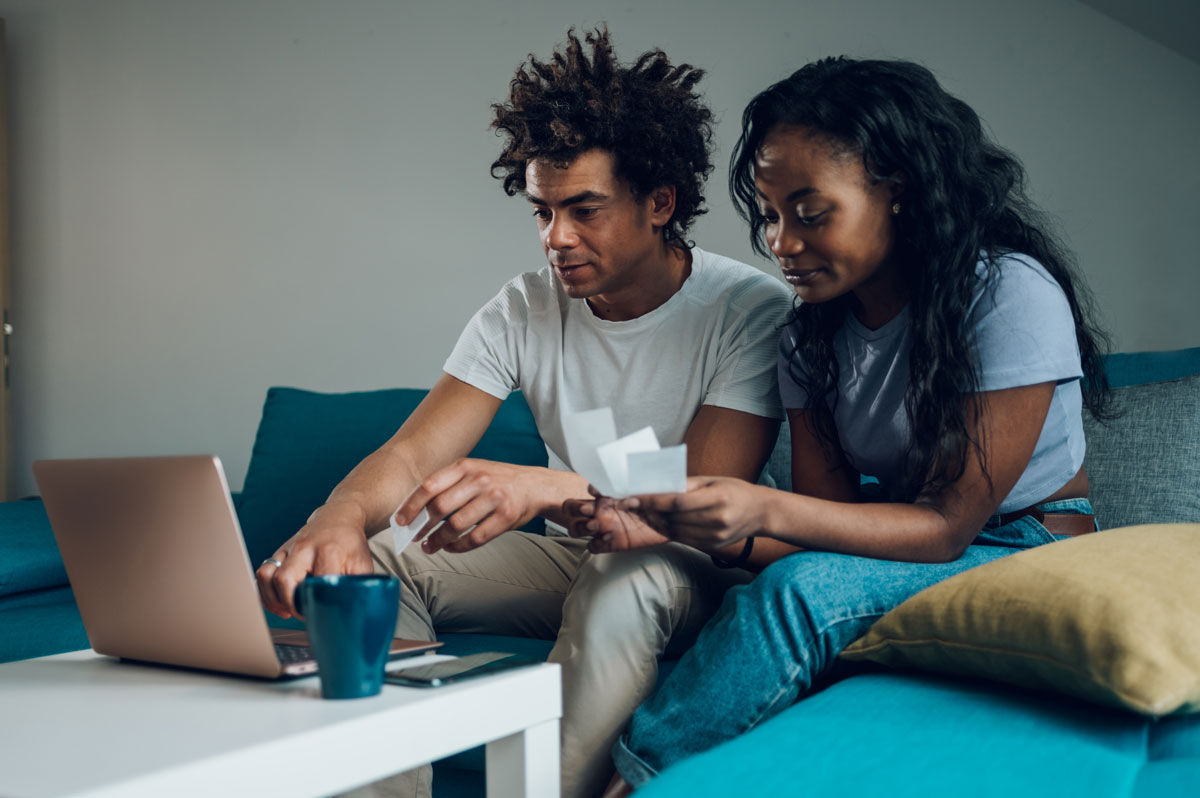 african-american-couple-using-a-laptop-and-a-credi-2022-05-26-22-43-59-utc-min