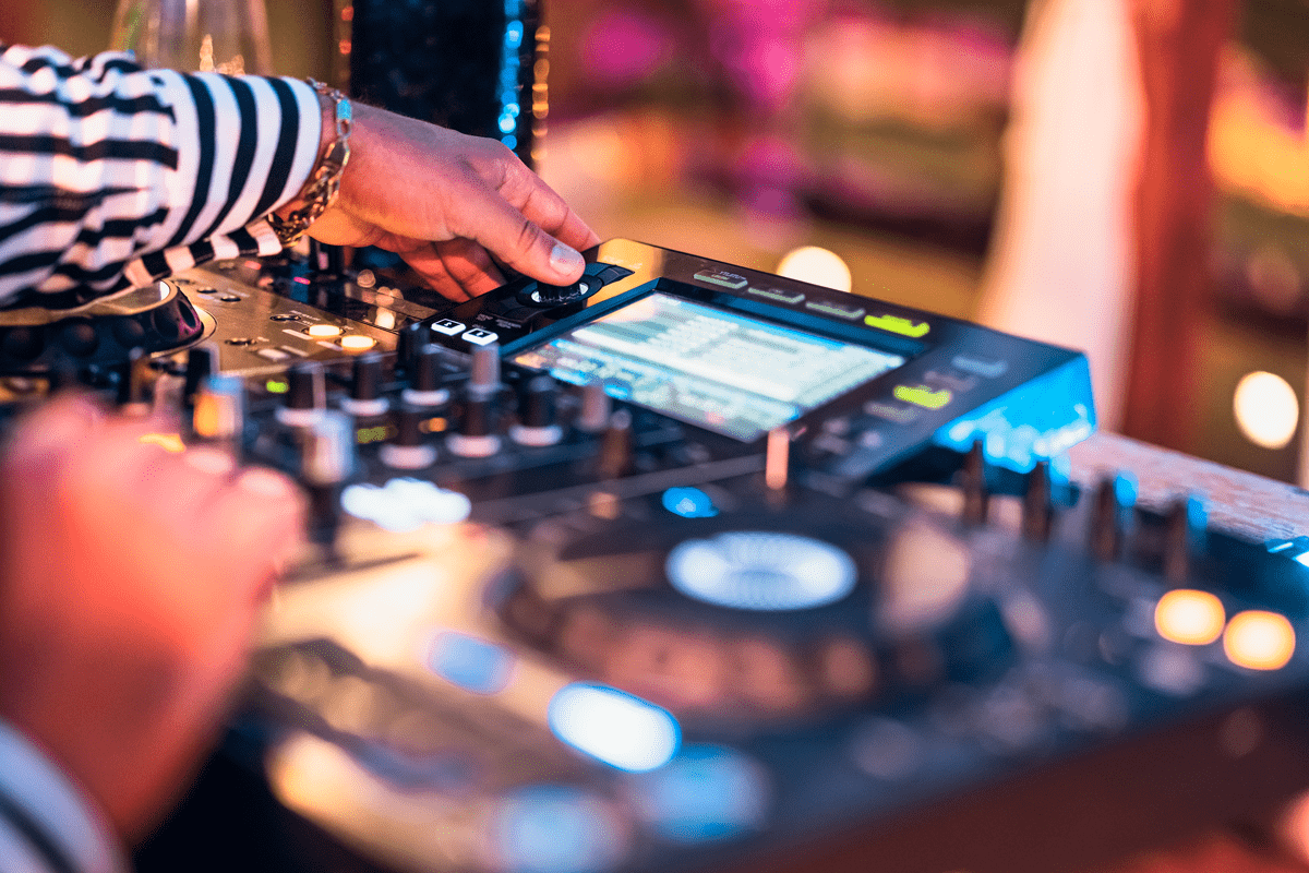 close-up-dj-hand-mixing-music-at-cocktail-bar-pa-2021-09-03-16-05-18-utc-min
