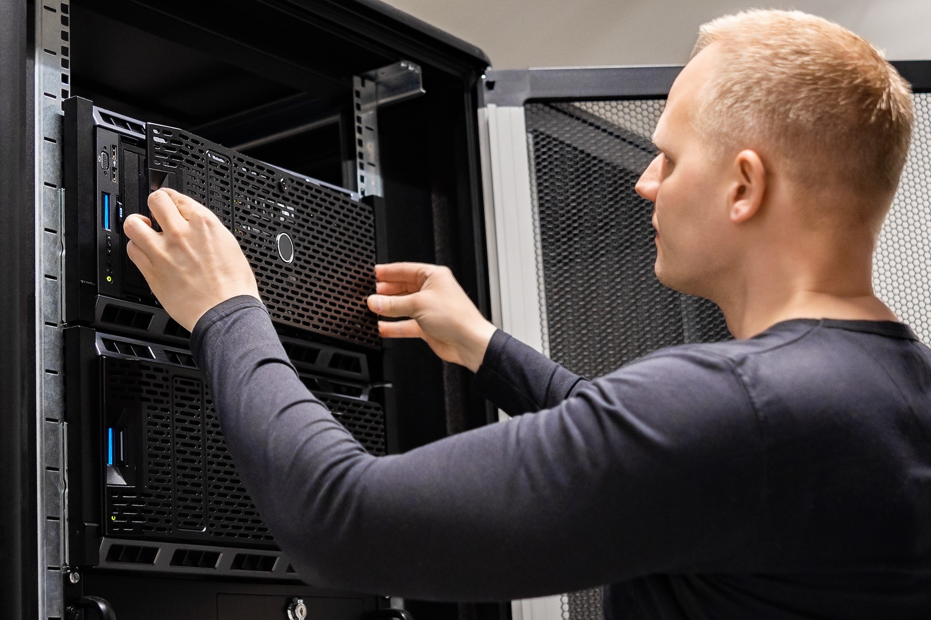 male-technician-installing-servers-in-enterprise-d-2023-11-27-05-00-17-utc